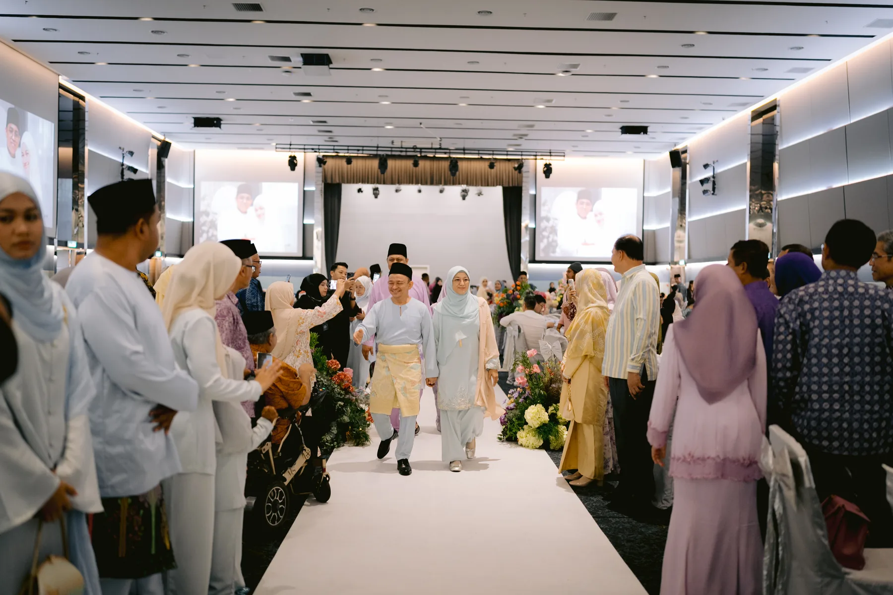 Family members entering a wedding celebration